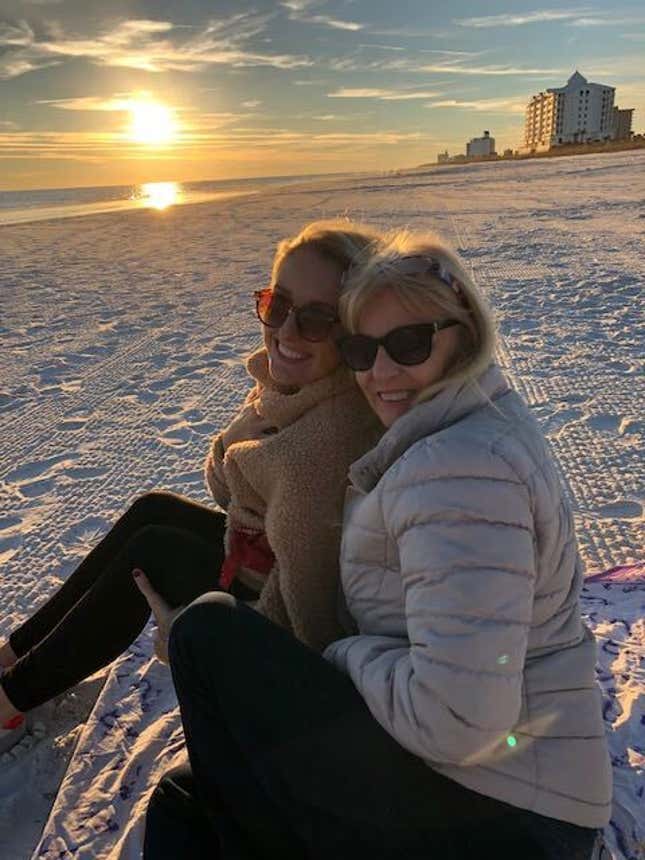 Hope and her mom on the beach at sunset