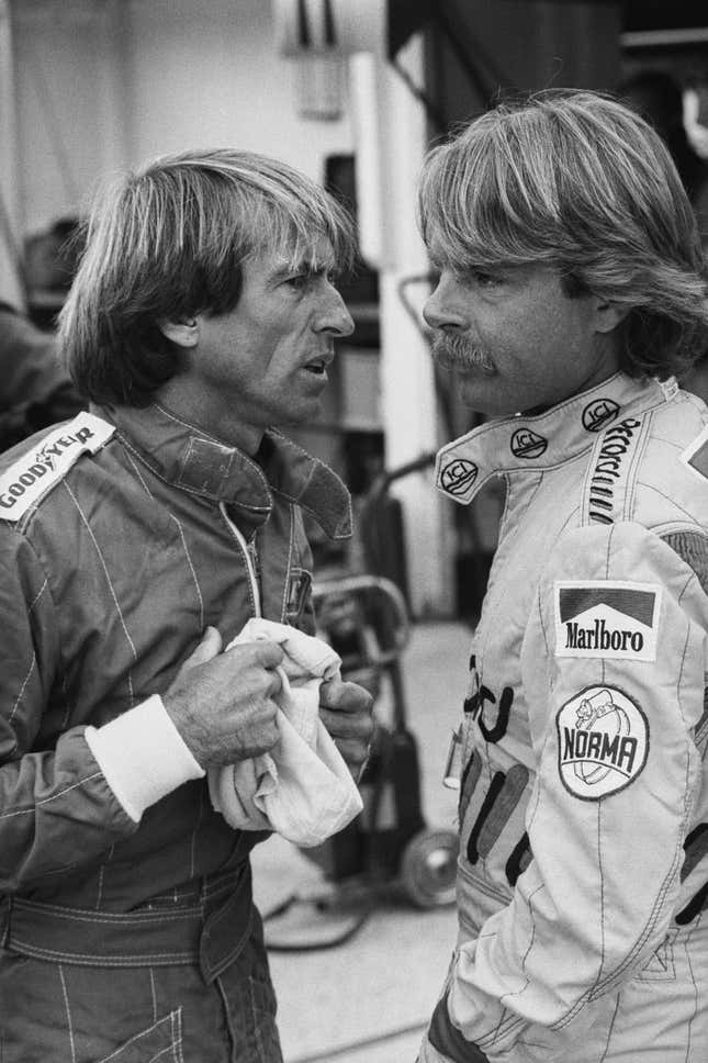 French racing driver Jacques Laffite of Team Williams-Honda chatting with Finnish racing driver Keke Rosberg of Team Williams-Honda during the British Grand Prix Qualifying at Brands Hatch Circuit, UK, 21st July 1984.