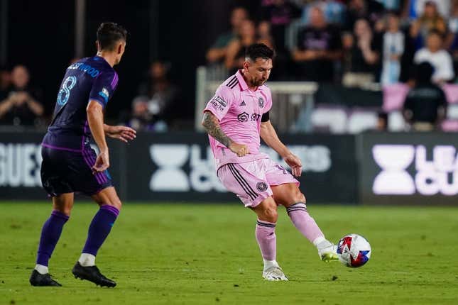 Aug 11, 2023; Fort Lauderdale, FL, USA; Inter Miami CF forward Lionel Messi (10) plays the ball as Charlotte FC midfielder Ashley Westwood (8) defends in the first half at DRV PNK Stadium.