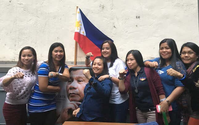 Duterte’s Hong Kong OFW fans strike a pose during a Sunday meeting.