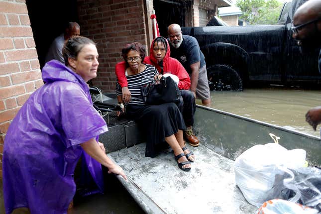 The Hawkins family is rescued in Beaumont Place, Texas, on Aug. 28.