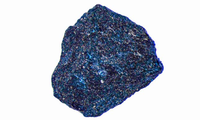 A one-millimeter diameter sample of glittery, cobalt-blue lutetium hydride.