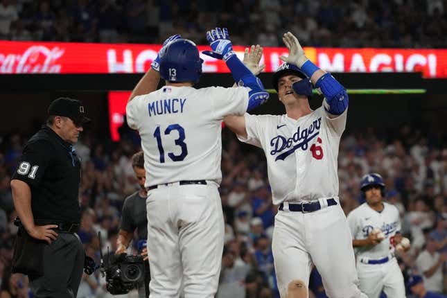 Aug 29, 2023; Los Angeles, California, USA; Los Angeles Dodgers catcher Will Smith (16) celebrates with third baseman Max Muncy (13) after hitting a home run in the sixth inning against the Arizona Diamondbacks at Dodger Stadium.