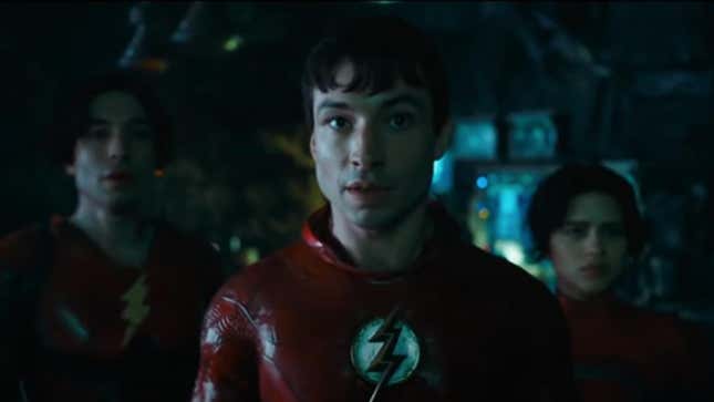 Two versions of the Flash are pictured with Supergirl.