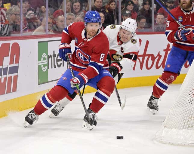 Feb 25, 2023; Montreal, Quebec, CAN; Montreal Canadiens defenseman Mike Matheson (8) plays the puck and Ottawa Senators forward Brady Tkachuk (7) forechecks during the first period at the Bell Centre.