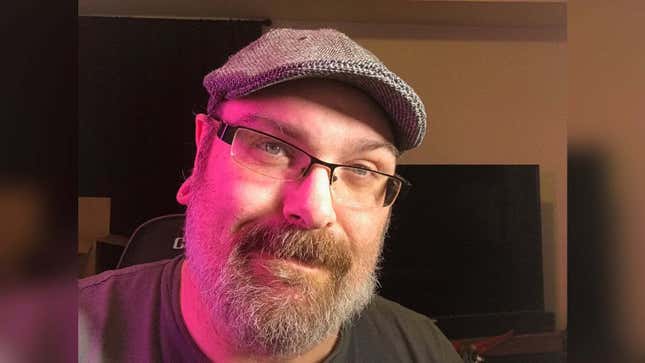 Mike Fahey of Kotaku looks toward the camera while sitting in a gaming chair.