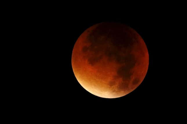 A supermoon is seen in the sky in Colmar, France, September 28, 2015. Sky-watchers around the world were treated when the shadow of Earth cast a reddish glow on the moon, the result of rare combination of an eclipse with the closest full moon of the year. The total "supermoon" lunar eclipse, also known as a "blood moon" is one that appears bigger and brighter than usual as it reaches the point in its orbit that is closest to Earth.