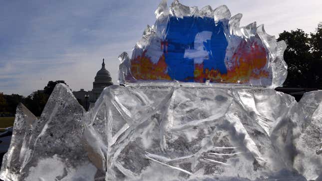 The Facebook logo contained within a 5,000-lb ice sculpture erected by climate activists protesting the company's handling of climate change denialism in front of the U.S. Capitol on Nov. 4, 2021.