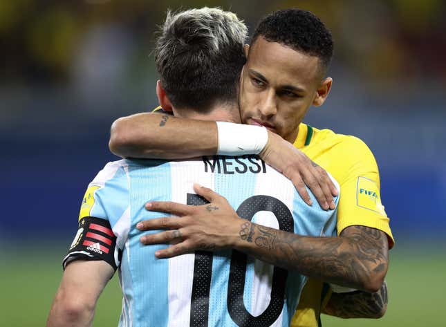Neymar and Messi hug it out.