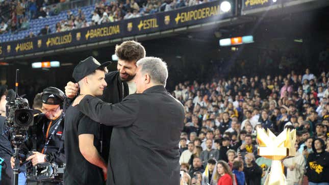 Gerard Piqué and Joan Laporta, president   of FC Barcelona, congratulate Adri Contreras.