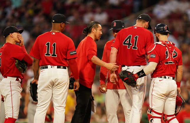 June 1, 2023;  Boston, MA, USA;  Boston Red Sox manager Alex Cora (13) relieves starting pitcher Chris Sale (41) during a timeout against the Cincinnati Reds in the fourth inning at Fenway Park.