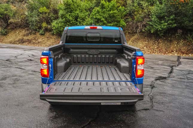 The bed, shown with lowered tailgate, of the 2023 Ford Maverick XL.