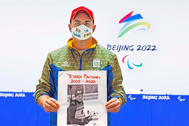  Lee Reaney, a journalist working for the Kyiv Post, holds a photo of Yevhen Malyshev, a biathlete who was killed in a Russian bombing in Kharkiiv.
