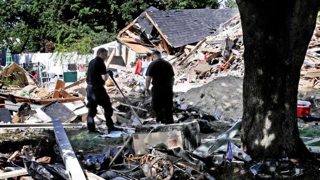 Firefighters search in the debris of homes destroyed by a gas incident in Massachusetts in 2018; one person was killed, while more than 80 fires destroyed buildings in three towns.