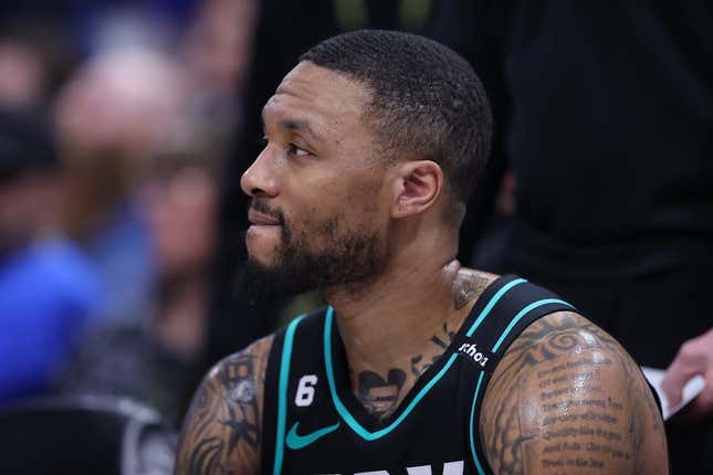 Mar 22, 2023; Salt Lake City, Utah, USA; Portland Trail Blazers guard Damian Lillard (0) looks on during a time out against the Utah Jazz in the third quarter at Vivint Arena.