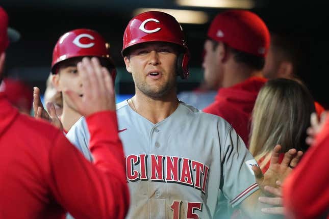 May 15, 2023; Denver, Colorado, USA; Cincinnati Reds center fielder Nick Senzel (15) celebrates scoring a run in the fourth inning against the Colorado Rockies at Coors Field.