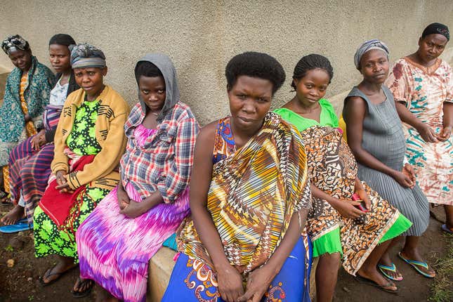 Surrounded by pregnant women and their caretakers, Jackeline Nikungu, 32, (center) waits to give birth to her fifth child.