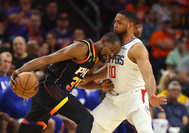 Apr 25, 2023; Phoenix, Arizona, USA; Phoenix Suns forward Kevin Durant (35) drives to the basket against Los Angeles Clippers guard Eric Gordon (10) during the first half in game five of the 2023 NBA playoffs at Footprint Center.