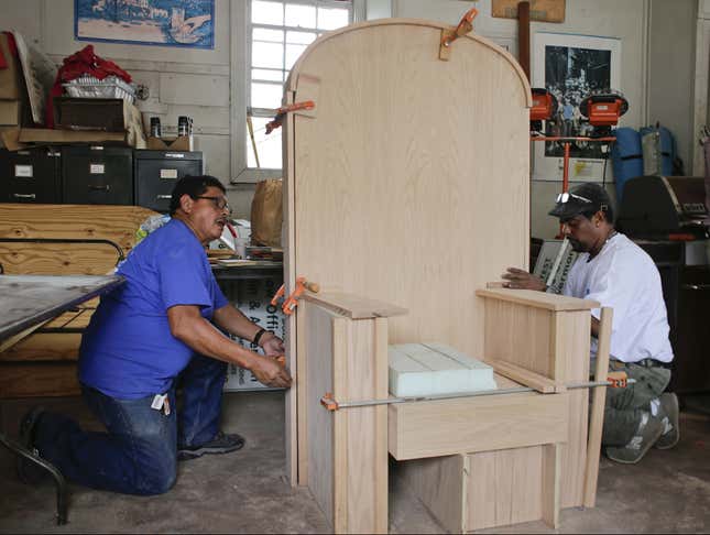 Dream assignment: Santamaria and Hernandez working on the pope’s chair.
