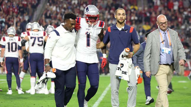 DeVante Parker being helped off the field