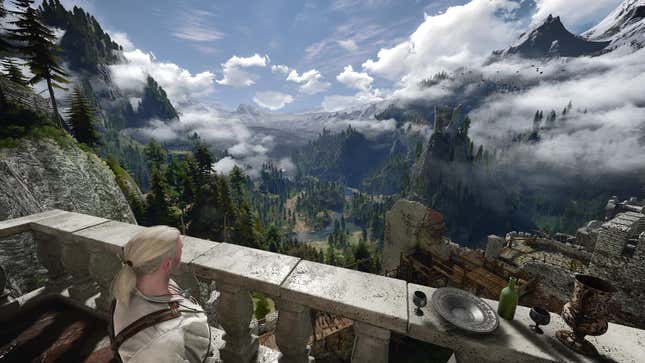 Geralt looks out over the mountainscape of Kaer Morhen.