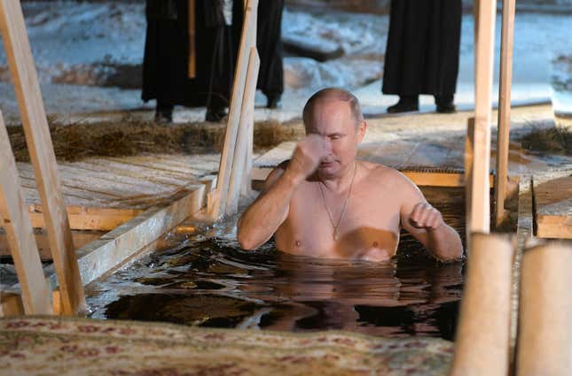 Russian President Vladimir Putin croses himself as he takes a dip in the water during Orthodox Epiphany celebrations at Lake Seliger, Russia on Jan. 19.
