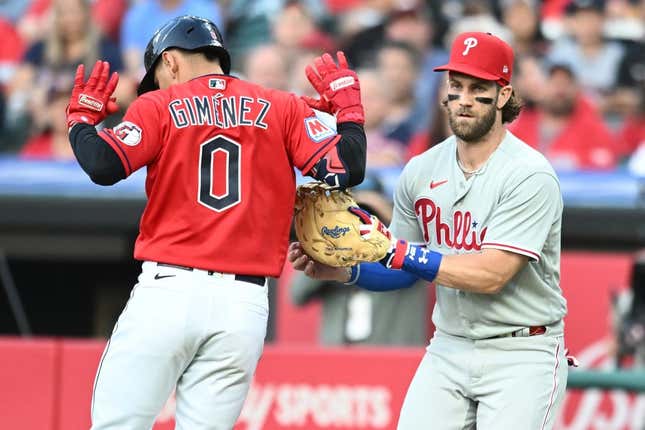 Jul 21, 2023; Cleveland, Ohio, USA; Philadelphia Phillies first baseman Bryce Harper (3) tags out Cleveland Guardians second baseman Andres Gimenez (0) during the fourth inning at Progressive Field.