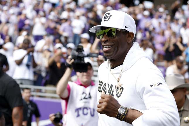Sep 2, 2023; Fort Worth, Texas, USA; Colorado Buffaloes head coach Deion Sanders runs on the field before the game against the TCU Horned Frogs at Amon G. Carter Stadium.