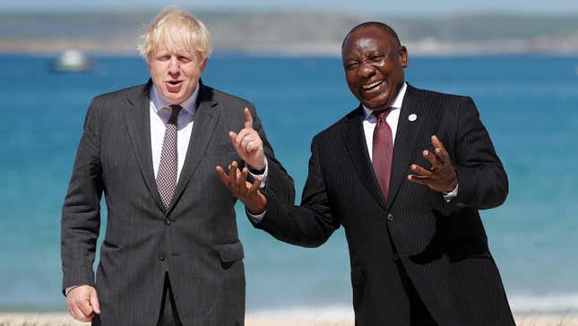 Britain's Prime Minister Boris Johnson, left, poses with South Africa's President Cyril Ramaphosa during an official welcome at the G7 summit.