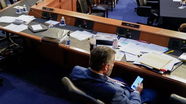 Ted Cruz, R-Texas, checks his phone during the Senate Judiciary Committee confirmation hearing for Supreme Court nominee Judge Ketanji Brown Jackson on Capitol Hill on Mar. 23, 2022 in Washington, DC