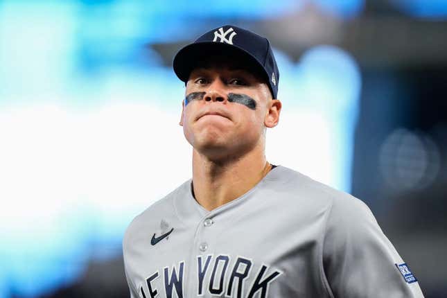 Aug 12, 2023; Miami, Florida, USA; New York Yankees right fielder Aaron Judge (99) runs back to the dug out against the Miami Marlins during the fifth inning at loanDepot Park.
