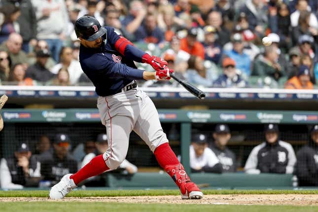 Apr 6, 2023; Detroit, Michigan, USA; Boston Red Sox center fielder Adam Duvall (18) hits a three run home run in the sixth inning against the Detroit Tigers at Comerica Park.