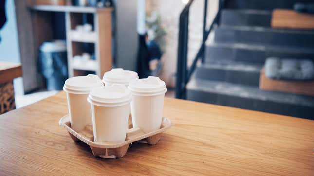 Four coffees in disposable drink holder