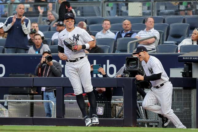 May 9, 2023; Bronx, New York, USA; New York Yankees right fielder Aaron Judge (99) and first baseman Anthony Rizzo (48) take the field for the first inning against the Oakland Athletics at Yankee Stadium.