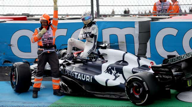 Daniel Ricciardo of Australia and Scuderia AlphaTauri climbs from his car after crashing during practice ahead of the F1 Grand Prix of The Netherlands at Circuit Zandvoort on August 25, 2023 in Zandvoort, Netherlands