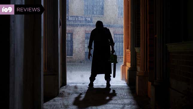 Leatherface stands in a doorway in silhouette, his chainsaw dangling from his hand.