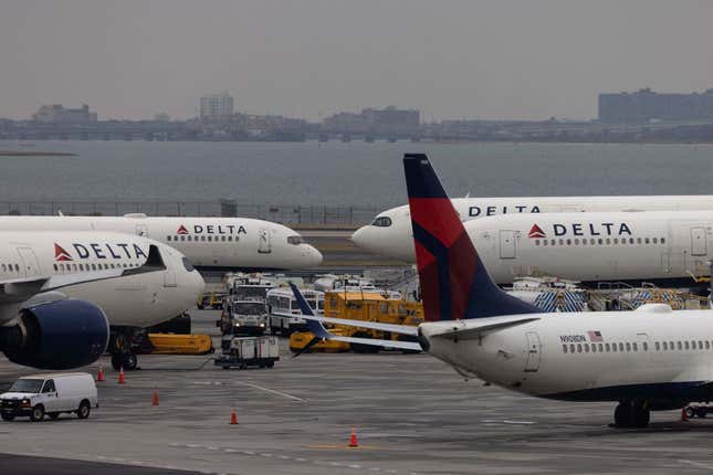 Delta Airlines passenger aircrafts are seen on the tarmac of John F. Kennedy International Airpot in New York, on December 24, 2021. 