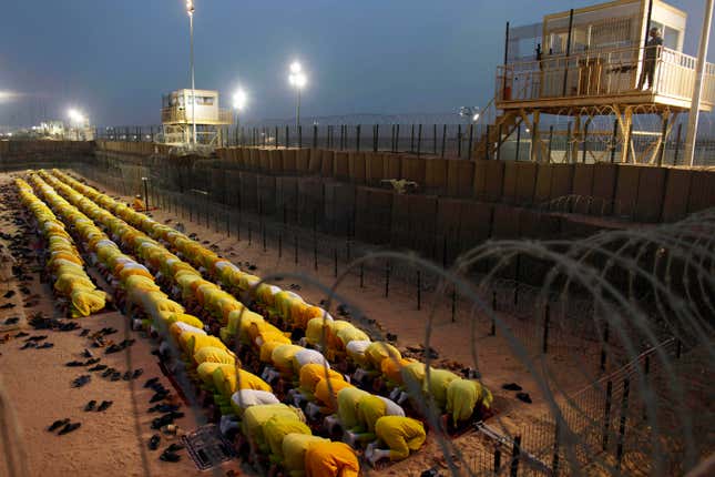 Detainees pray at Camp Bucca, a U.S.-run facility that closed in 2009.