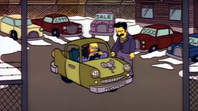 A still from the animated series The Simpsons of Homer trying to squish himself inside a very tiny eastern European car. The car is two tone green and has a mosquito as the hood ornament.