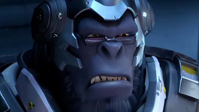 Overwatch character Winston, seen in a cinematic, frowns from behind his glasses. 