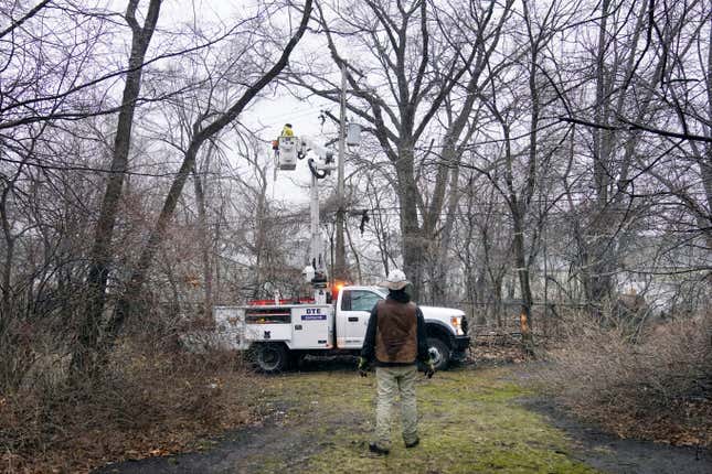 A DTE contractor crew works on a power line, Monday, Feb. 27, 2023, in northwest Detroit.
