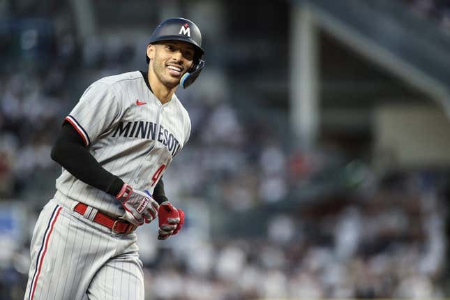 Apr 13, 2023; Bronx, New York, USA;  Minnesota Twins shortstop Carlos Correa (4) reacts after hitting a sole home run in the first inning against the New York Yankees at Yankee Stadium.