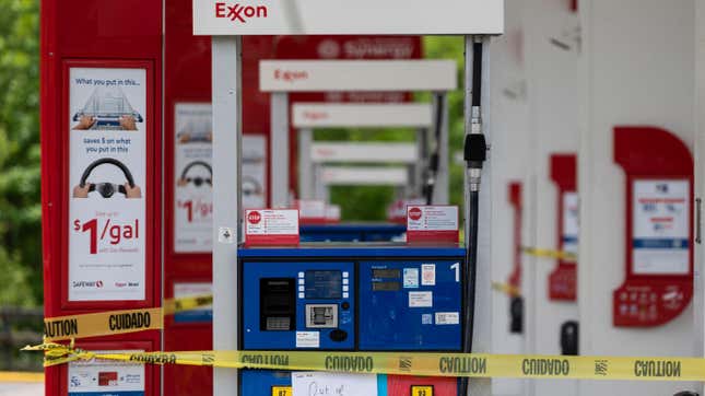 Out of order notes and caution tape are seen on gasoline pumps.