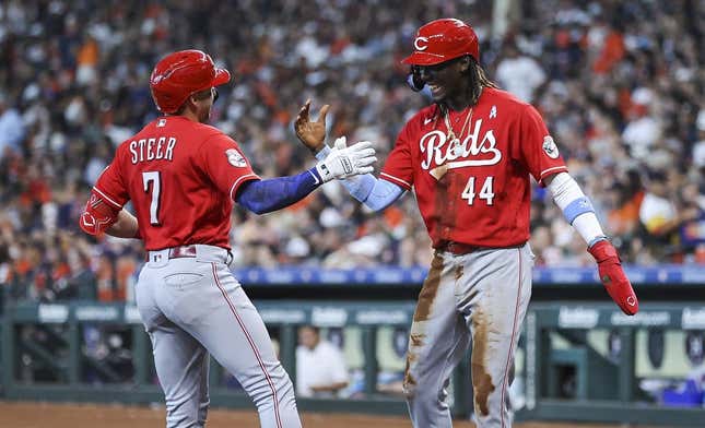Jun 18, 2023; Houston, Texas, USA; Cincinnati Reds first baseman Spencer Steer (7) celebrates with shortstop Elly De La Cruz (44) after hitting a home run during the sixth inning against the Houston Astros at Minute Maid Park.