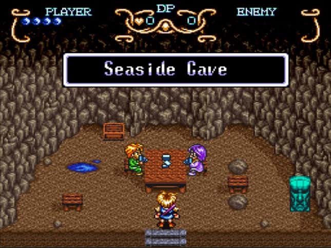 Pixellated art from the game Illusion of Gaia depicts a small cave in which two characters sit at a table and a third looks on. Text above them reads Seaside Cave.