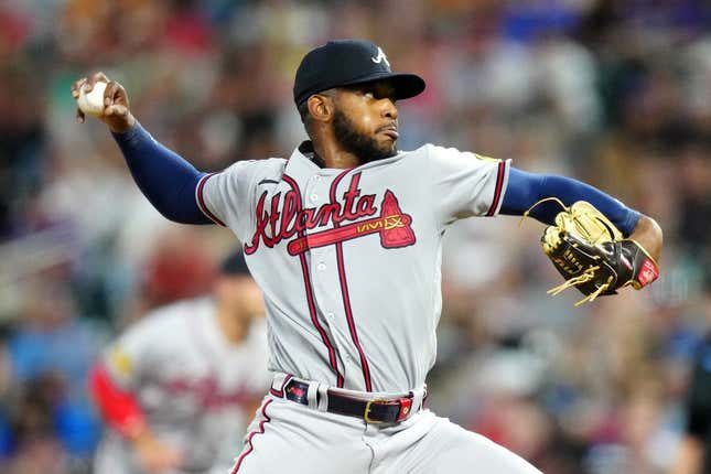 Aug 30, 2023; Denver, Colorado, USA; Atlanta Braves starting pitcher Darius Vines (64) delivers a pitch in the fourth inning against the Colorado Rockies at Coors Field.