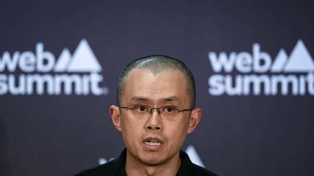 Chenpgeng Zhao staring to the side in front of a wall reading "web summit."