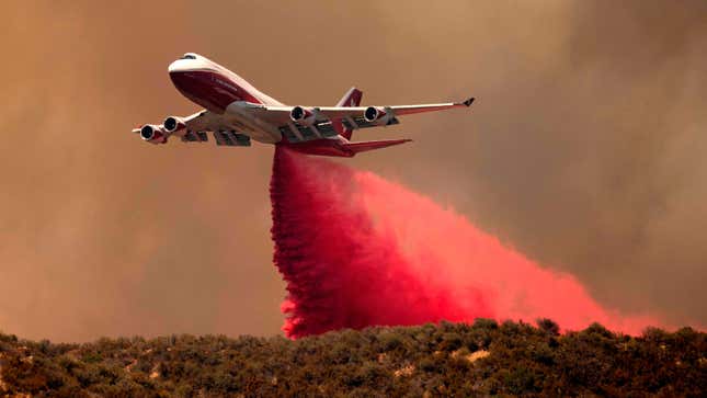 A photo of the Boeing 747 Supertanker dropping water on a fire. 