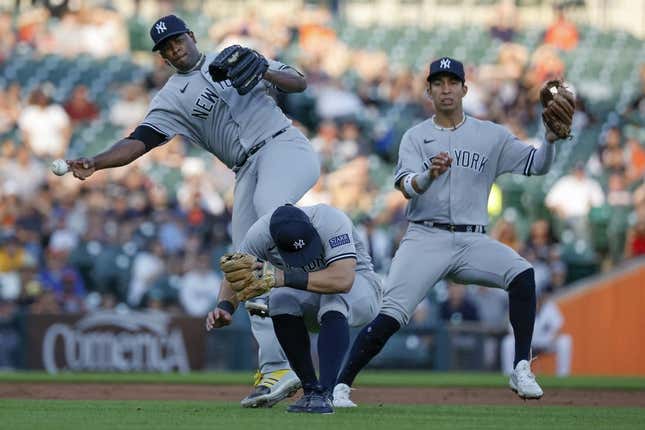 Aug 28, 2023; Detroit, Michigan, USA; New York Yankees starting pitcher Luis Severino (40) makes a throw to first as he avoids shortstop Anthony Volpe (11) and third baseman Gleyber Torres (25) in the second inning at Comerica Park.