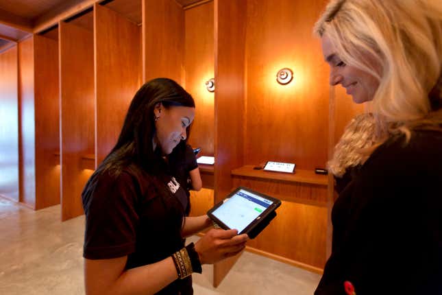 A PUBLIC Advisor helping a guest checkin at Ian Schrager's new PUBLIC Hotel.